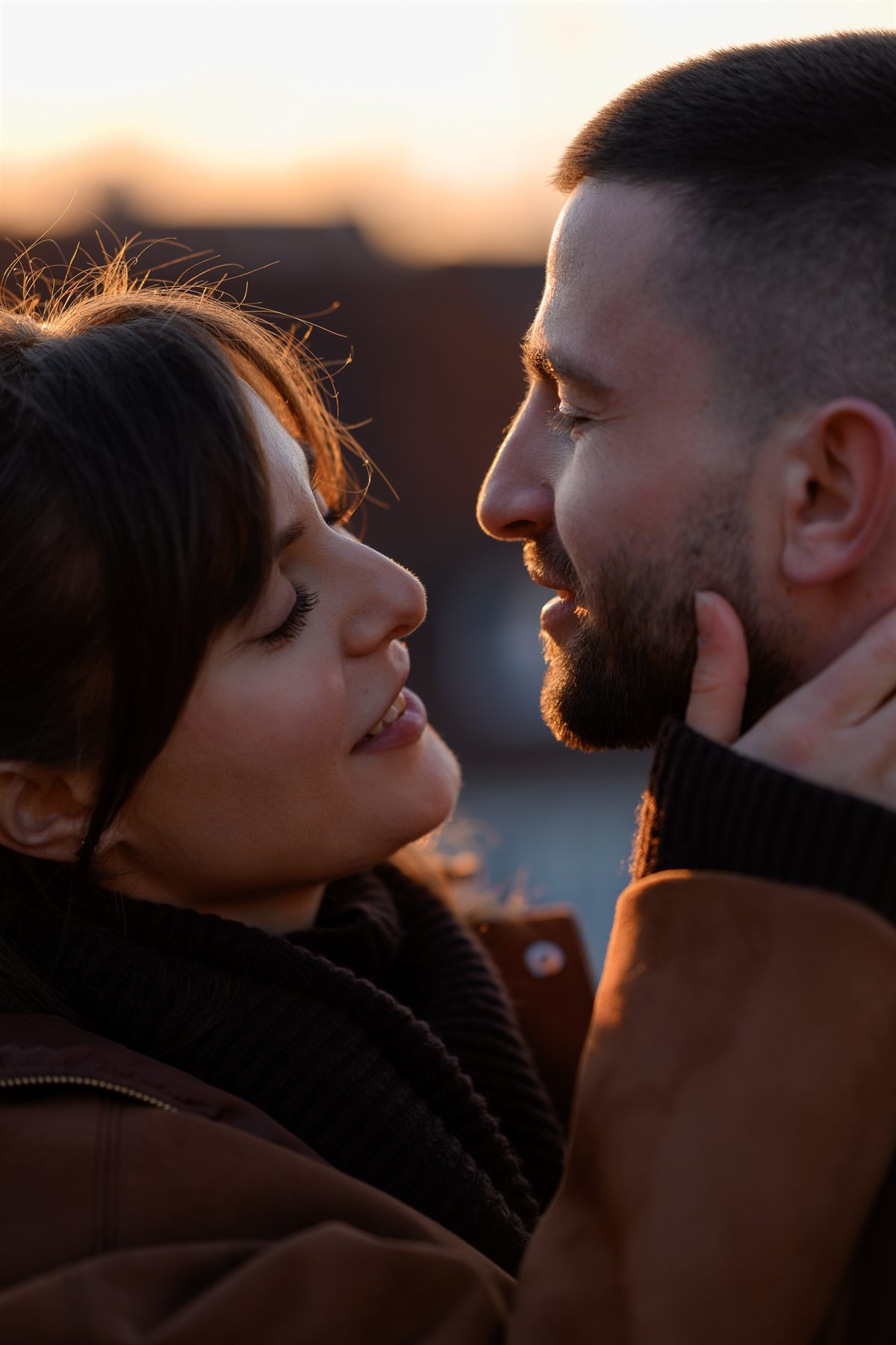 Close-up of a couple about to kiss in warm evening light