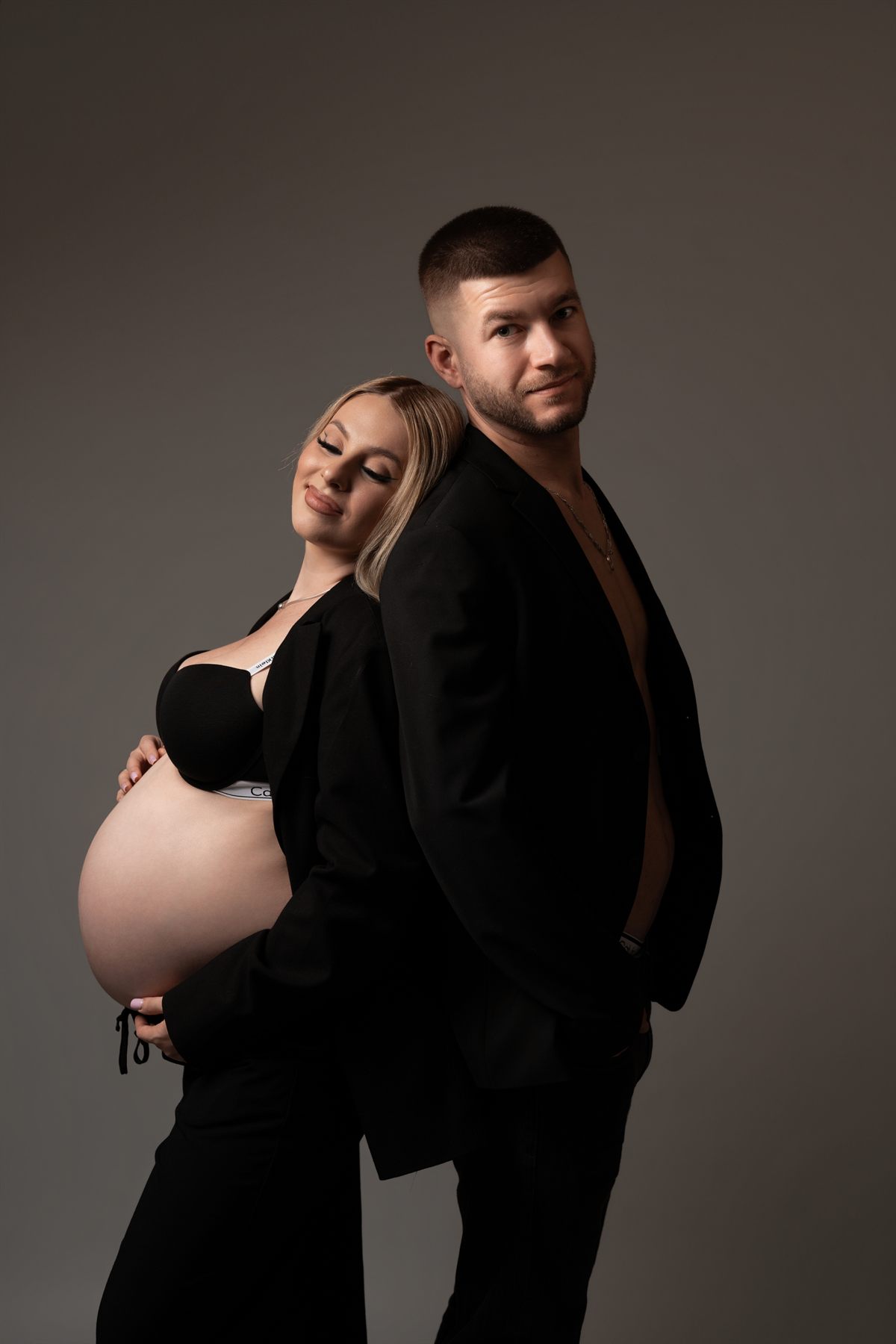 An expecting couple in the studio