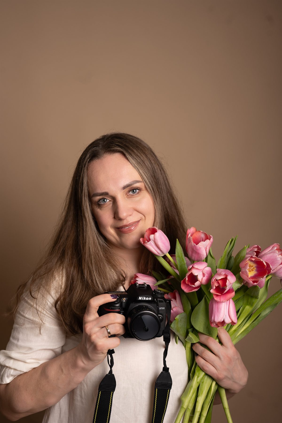 Yuliya with her camera and an armful of tulips